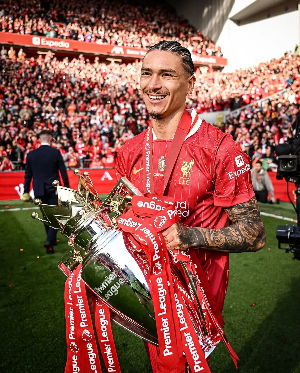 Darwin Núñez celebrating with the Premier League trophy at Anfield